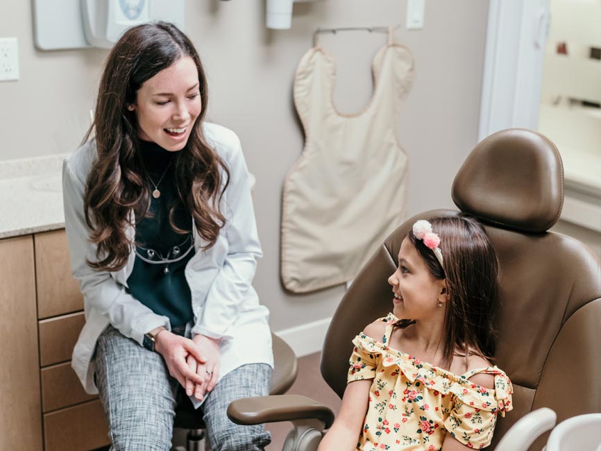 Doctor conversing with young patient